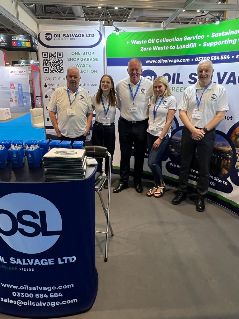 the Oil Salvage team in front of their stand at automechanika