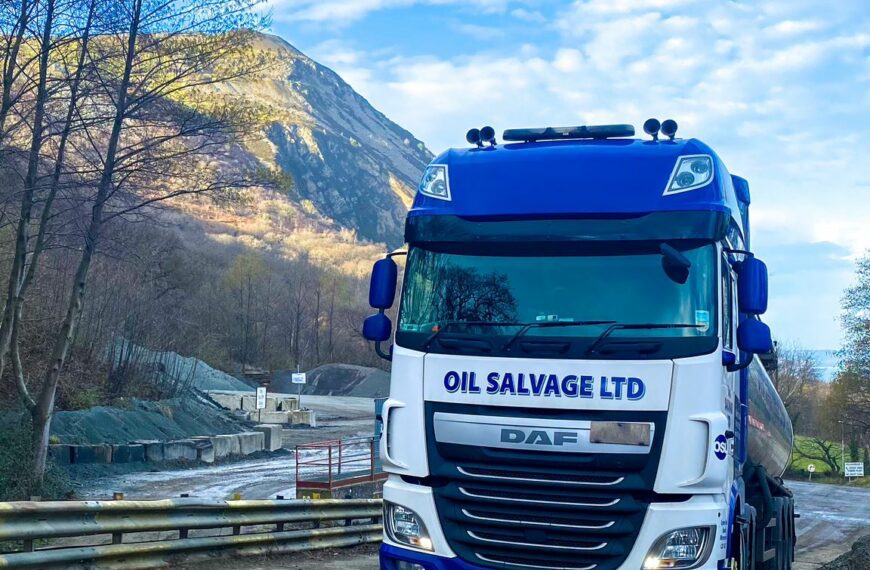 an osl truck in front of a blue sky